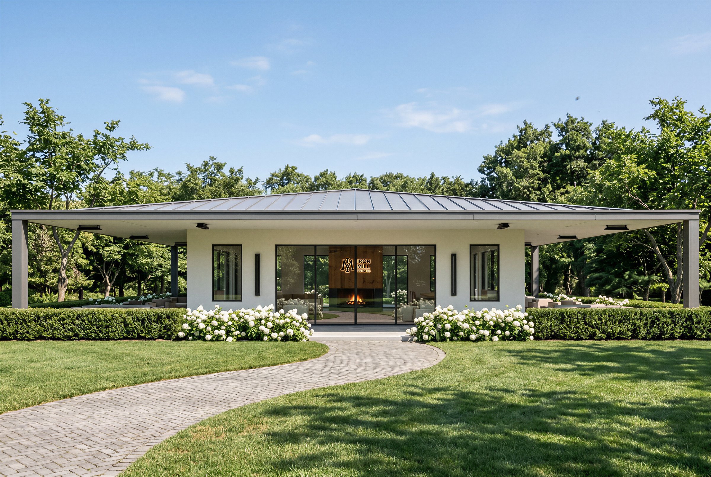 Iron Mill Estates resident clubhouse: white stucco pavilion with wide overhanging eaves and a lit fireplace framed by glass